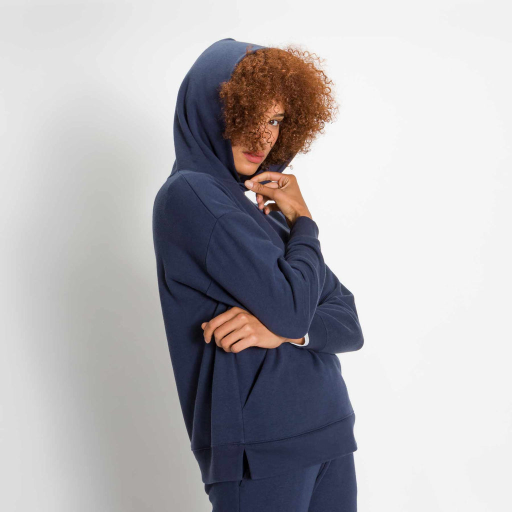 Sweatshirt - Women's Relaxed Hoodie in Navy Blue on model with hood up